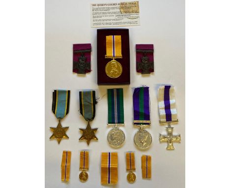 A Northern Ireland Prison Service Medal on ribbon (copy), a similar copy General Service Medal 1918-62 with Copy Palestine cl