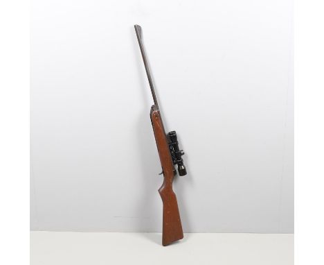 A BSA Air Rifle with a 47cm barrel marked BSA Guns Ltd England .22 Fitted with an SMK 4 x 28 sight. 105cm overall.  *CR:  Scu