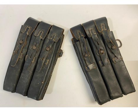 Two German Second World War black leather Ammunition Pouches, probably for a submachine gun, each with 3 sections and 2 belt 
