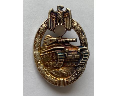 A German Panzer Assault badge in 'silver' with thin vertical pin, possibly an early copy. 58 x 40mm.  *CR:  Slightly tarnishe