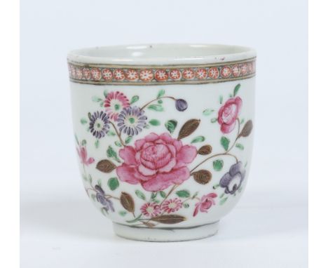 A Chinese Qianlong (1736-1795) coffee cup with plain loop handle. Painted in coloured enamels with flowers under a cell borde