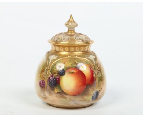 A Royal Worcester pot pourei jar with pierced cover by Edward Townsend. With gilt mouldings and painted with apples and black