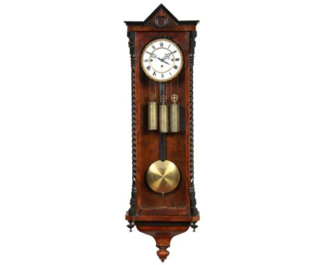 A nineteenth century walnut cased triple weight Vienna wall clock with ebonized mouldings and sugar twist supports. With enam