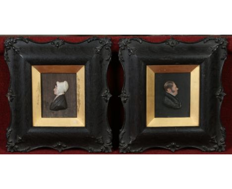 A pair of Victorian framed relief work coloured wax portraits. Portrait of a lady and gent, 11cm x 9cm. Condition Report. To 