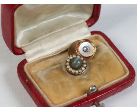 Two yellow metal collar studs in a fitted leather mounted box. One set with a solitaire diamond over a mother of pearl ground