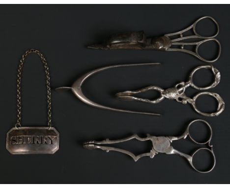 Three pairs of silver sugar nips including a novelty pair formed as a wishbone, a pair of silver candle snuffers and a pierce