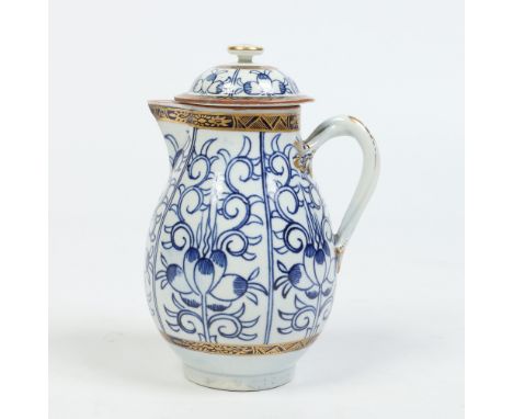A Worcester sparrow beak jug and cover with entwined loop handle, painted in underglaze blue and gilt with the Royal Lilly pa