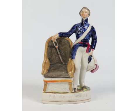 A Victorian Staffordshire portrait figure of the Prince of Wales in uniform and stood by a chair. Coloured in enamels and the
