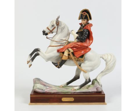 A Royal Worcester equestrian figure of Napoleon Bonaparte crossing the alps by Bernard Winskill. Raised on a brass inlaid ros