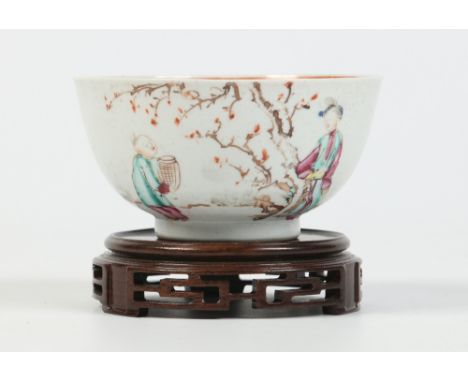 A small eighteenth century Chinese bowl on associated hardwood plinth. Decorated in coloured enamels with Mandarin figures, 1