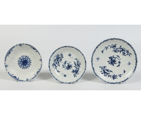 Three Worcester crisply moulded saucer dishes; two painted in underglaze blue with the Feather Mould Floral pattern and the o