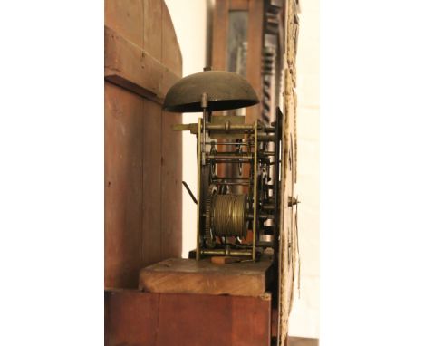 A nineteenth century mahogany eight day longcase clock. With brass arch top dial ornamented with spandrels and a relief medal