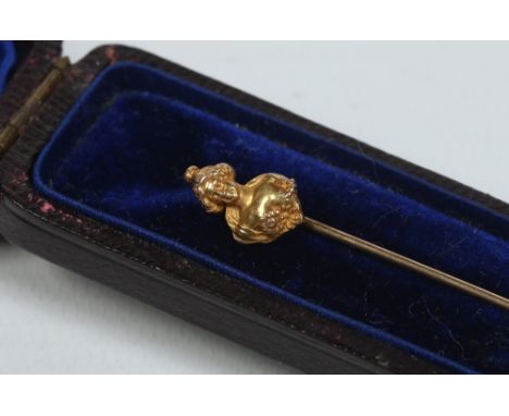 A cased Art Nouveau 14 carat gold stick pin, the terminal formed as a woman, 1.56 grams. Condition Report. To be used as a gu