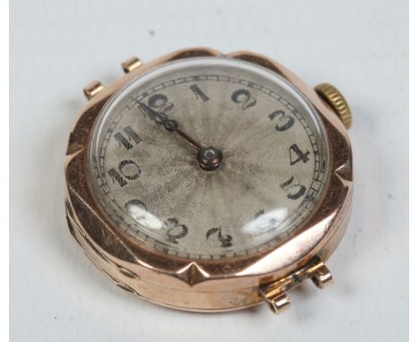 A ladies Rolex Unicorn 9 carat gold cased manual wristwatch head. With engine turned engraved silver dial having black enamel