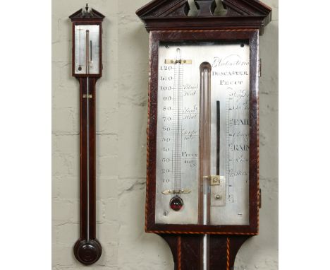 A George III mahogany stick barometer. With silvered dial signed G. Volonterio, Doncaster. With strung inlay and triangular o