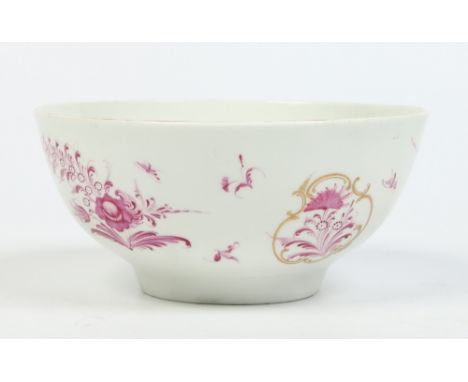 A Worcester bowl decorated in the Meissen style with puce enamel flowers and gilt mirror cartouches c1765, 15.5cm diameter.  