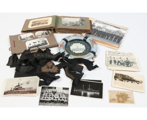 Navy interest. A decorative small model life belt wall plaque for H. M. S. Curacoa, a post card album containing views of Ita