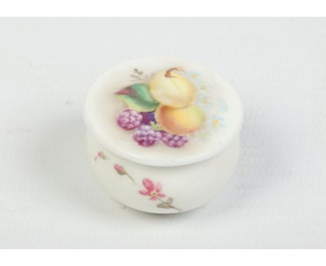 A miniature Royal Worcester pot and cover. Decorated with fruit and flower sprigs. Printed puce mark 1922. 3.25cm diameter. C