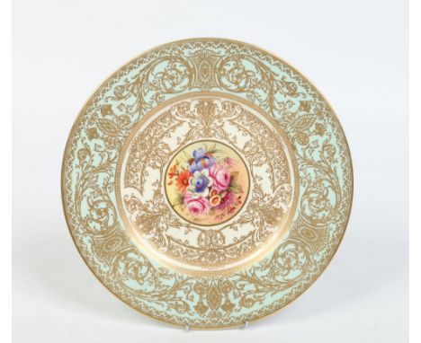 A Royal Worcester cabinet plate by John Freeman. With a wide turquoise ground border finely gilded with Classical scrollwork 