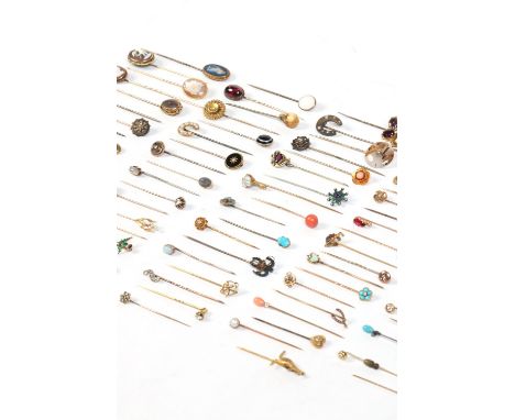 A very good collection of ninety eight Victorian and later yellow metal stickpins. Including gem set examples and novelty ter