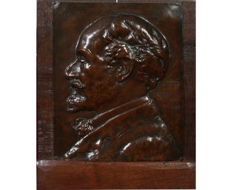An oak mounted relief work copper portrait plaque of T. P. Spall dated 1910. Signed Bevan, 43cm x 37cm. Condition Report. To 
