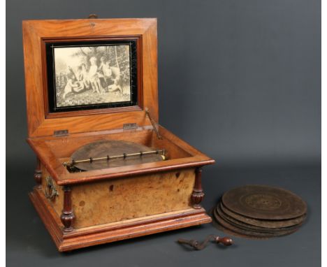 A nineteenth century German Symphonion rosewood and walnut cased musical box with double comb and sold with eleven discs. Wit