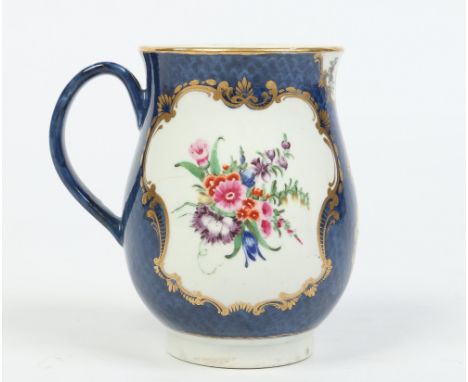 A Worcester baluster mug with grooved loop handle. Scale blue ground and with tooled gilt cartouches enamelled with flower bo