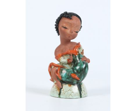 A Goldscheider terracotta figure of a young girl with a dolphin designed by Kurt Goebel. Decorated in green and red glazes. P