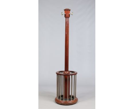 A Victorian turned mahogany column coat stand. With hexagonal terminal having three pegs and with a circular umbrella / stick