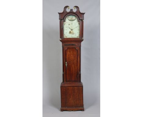 A George III oak and mahogany longcase clock. Housing a thirty hour movement and with painted arch top dial signed Holliwells