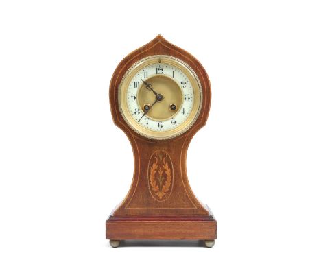 An Edwardian mahogany balloon mantel clock. With gilt dial having enamel chapter ring with Arabic numeral markers. Having mar