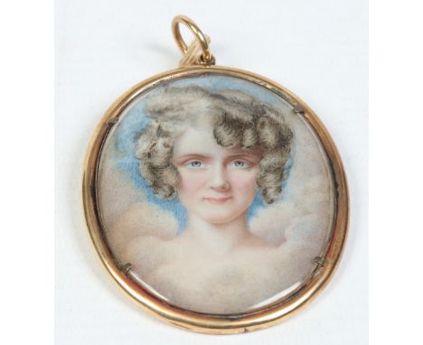 An ivory portrait miniature of a young woman in gilt metal oval frame, 7cm. Condition Report. To be used as a guide only. Ivo