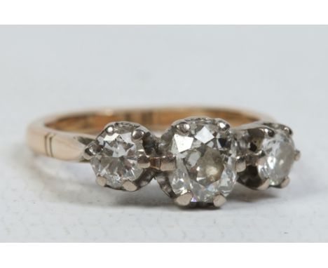 A Victorian 18 carat gold ring set with three old European cut diamonds approximately 1.0ct overall. Ring size K. Condition R