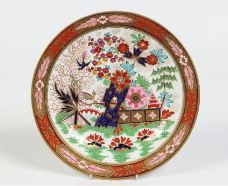 An early nineteenth century Worcester Flight, Barr & Barr plate decorated in the Imari style with a mock Oriental garden scen