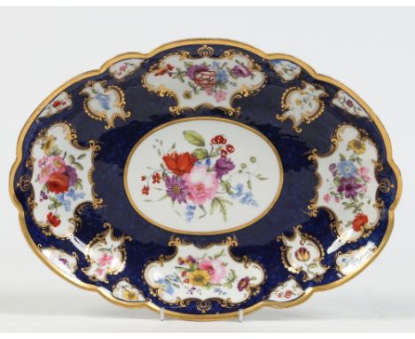 An early nineteenth century Worcester Flight, Barr & Barr fluted oval dessert dish. Scale blue ground and with gilt mirrored 