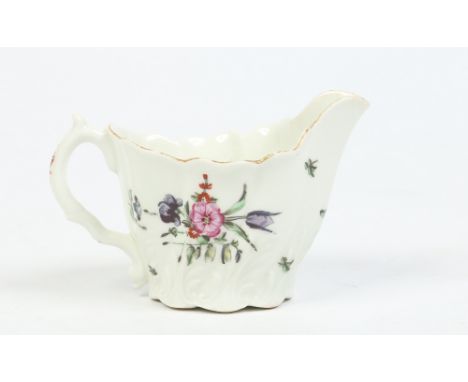 A Worcester low Chelsea ewer with acanthus moulding and enamelled in colours with flowers c1765, 6.5cm. Condition Report. To 