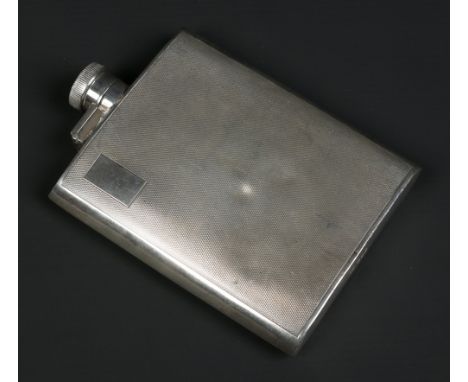 A George VI silver hip flask by Hamilton and Inches. With engine turned engraving. Assayed Edinburgh 1938, 13.5cm. Condition 