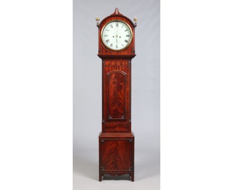 A Regency carved and figured mahogany eight day longcase clock by D. Greig, Perth. With painted circular dial having Roman nu