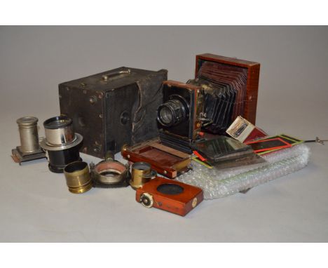 A Mahogany View Camera, with a Berthiot Eurygraphe 180mm f/6.3 lens, a Thornton Pickard shutter together with a quantity of c