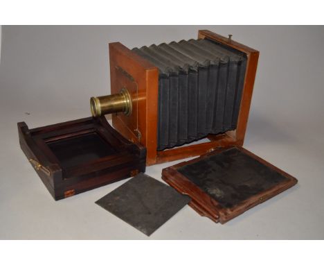 A 12" x 10" Mahogany  &amp; Brass Plate Camera, fixed back, bellows,  moveable front and lens board, with a Ross brass lens, 
