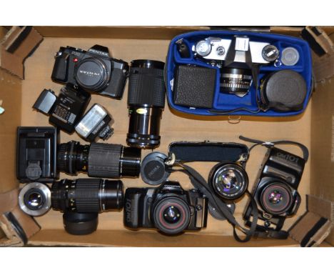 A Group of Olympus, Pentax and Praktica SLR Cameras, including Olympus OM101 cameras (2), a Pentax P30 with a Pentax-M 50mm f