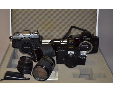 A Group of 35mm Cameras, Lenses and Accessories, including a Minolta X-300 SLR camera, winding lever jammed, a Canon EOS 100 