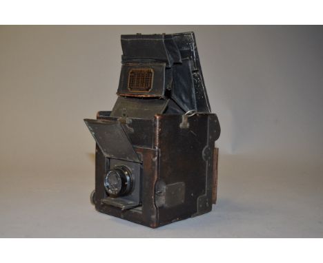 A Graflex Series B 2¼" x 3¼" SLR Camera condition P, two splits in viewing hood, with Carl Zeiss Jena 12cm f/4.5 lens, condit