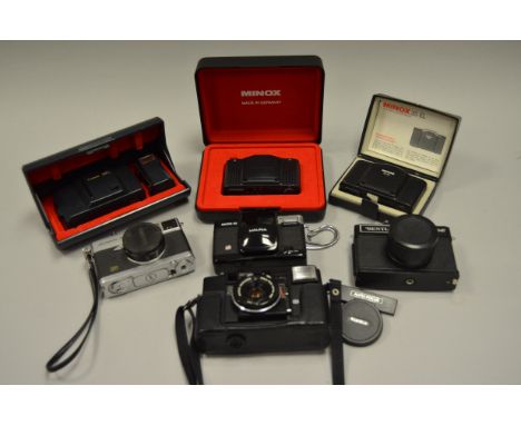 A Group of 35mm Compact Cameras, including Canon Demi S half frame, Canon MC AF, Halina Micro 35, Konica C35 AF, Minox 35 EL 