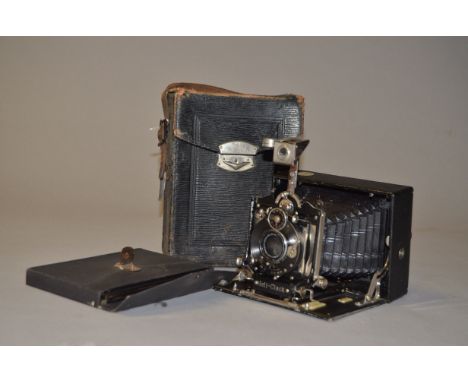 A Rietzschel's Heli-Clack 3¼"x 4¼" Folding Plate Camera, black, with Doppel Anastigmat 135mm f/6.8 lens, dial set shutter wor