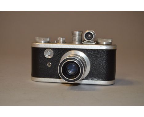 A Corfield Periflex 1 35mm Camera, top and bottom plates chrome colour, shutter not working, body VG, Lumar-X 50mm f/3.5 lens
