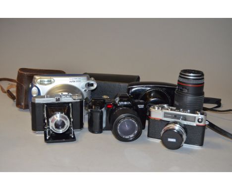 A Minolta Dynax 7000i SLR Body with Lenses, including a Sigma 28-70mm f/3.5-4.5 lens, a Sigma AF-APO 75-300mm f/4.5-5.6 lens,