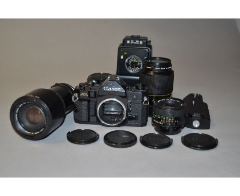 A Canon A1 SLR Camera Outfit, including Canon A1 body, serial no 1845926, Canon lenses, 28mm f/2.8, Macro FD 100mm f/4, 70-21