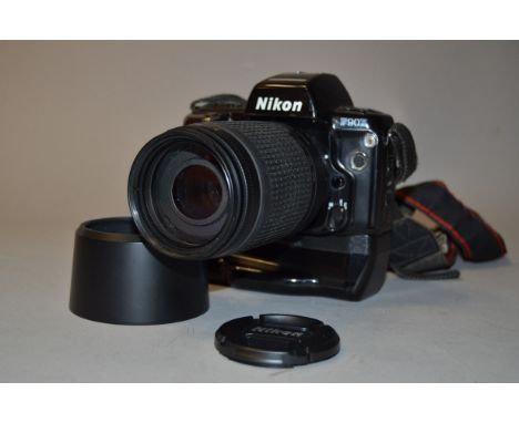 A Nikon F90X SLR Camera, serial no 2003687, condition F, sickiness at back near battery grip MB-10, and a AF-Nikkor 70-300mm 
