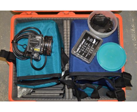 A Lowell ViP Pro Camera Lamp Kit, including one Lowel ViP head, barn doors, diffuser, dichroic filter, three fabric travel ba